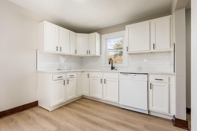 kitchen featuring dishwasher, light hardwood / wood-style flooring, white cabinetry, and sink