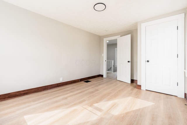 unfurnished bedroom featuring light hardwood / wood-style flooring