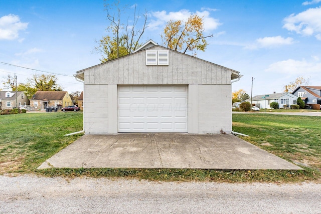 garage featuring a lawn