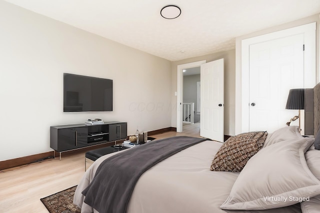 bedroom with light hardwood / wood-style floors