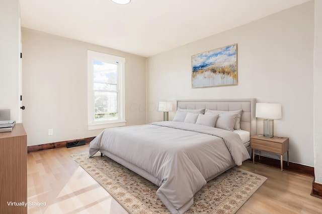 bedroom with light hardwood / wood-style flooring