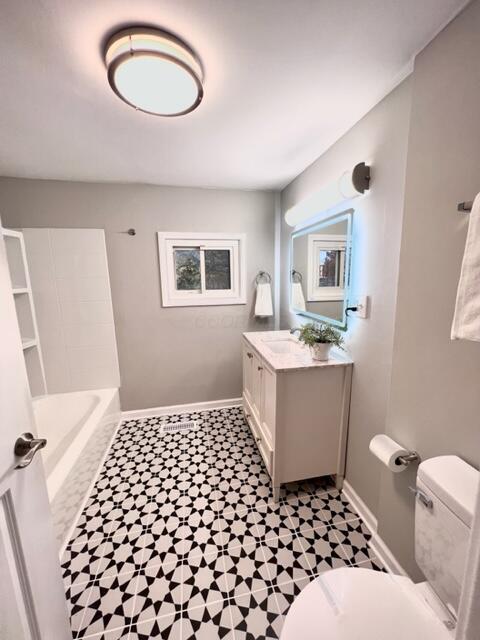 bathroom with vanity and toilet