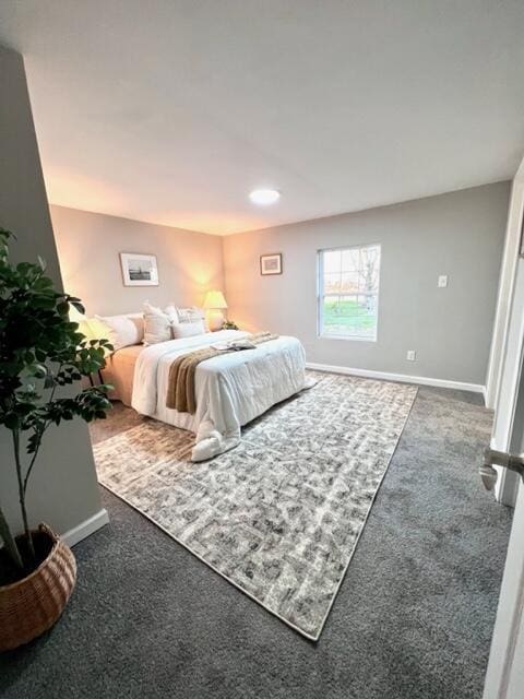 bedroom featuring dark carpet