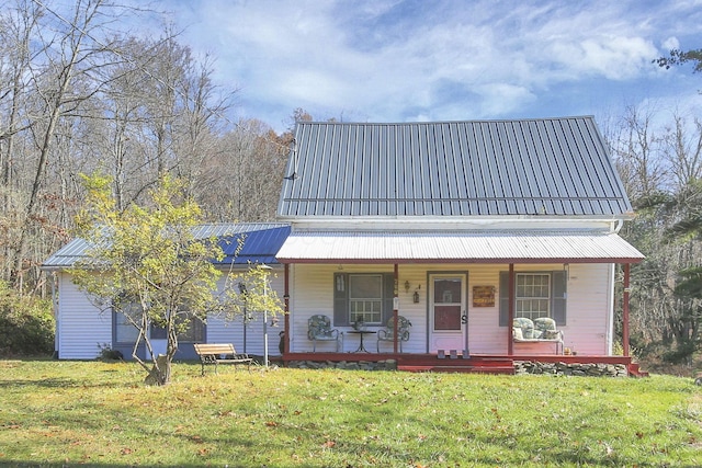 760 Henpeck Rd, Utica, OH 43080 - country-style home featuring covered porch, a front lawn, and a metal roof