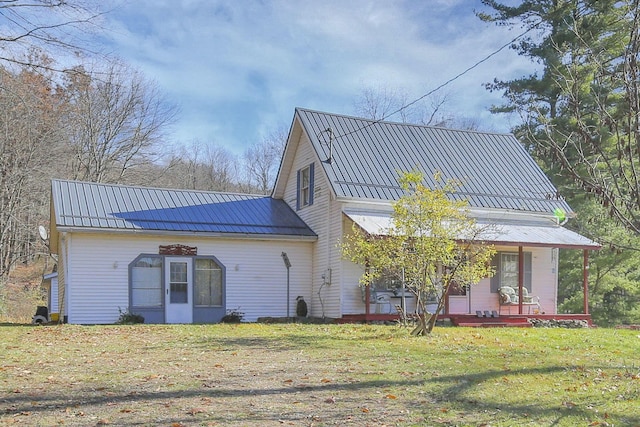 760 Henpeck Rd, Utica, OH 43080 - rear view of house with a lawn, a metal roof, and covered porch