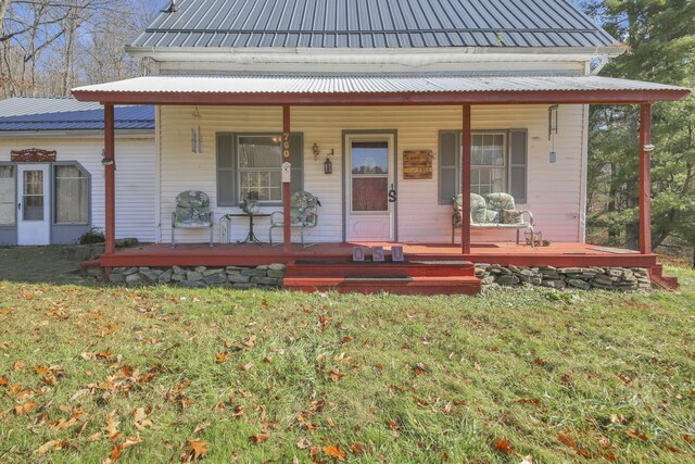760 Henpeck Rd, Utica, OH 43080 - farmhouse inspired home featuring covered porch, a metal roof, and a front yard