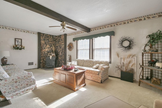 760 Henpeck Rd, Utica, OH 43080 - living area featuring light colored carpet, beamed ceiling, a ceiling fan, and a textured ceiling