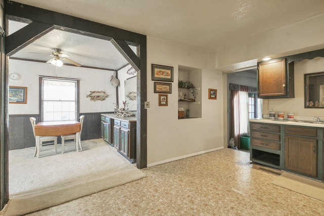 760 Henpeck Rd, Utica, OH 43080 - kitchen featuring plenty of natural light, ceiling fan, a wainscoted wall, light countertops, and light floors