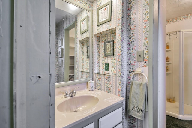760 Henpeck Rd, Utica, OH 43080 - bathroom with vanity, wallpapered walls, and a stall shower