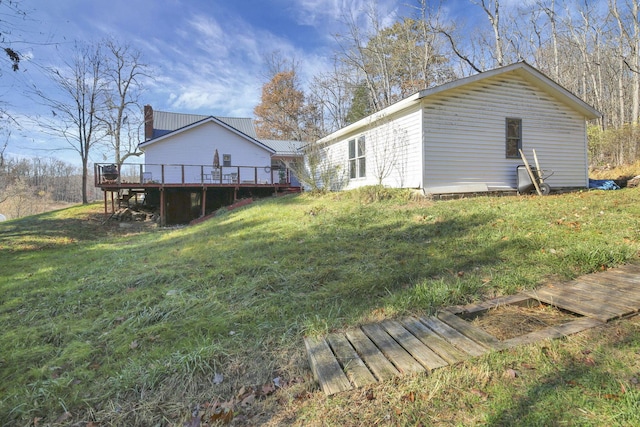 760 Henpeck Rd, Utica, OH 43080 - back of house featuring a wooden deck, a lawn, and a chimney