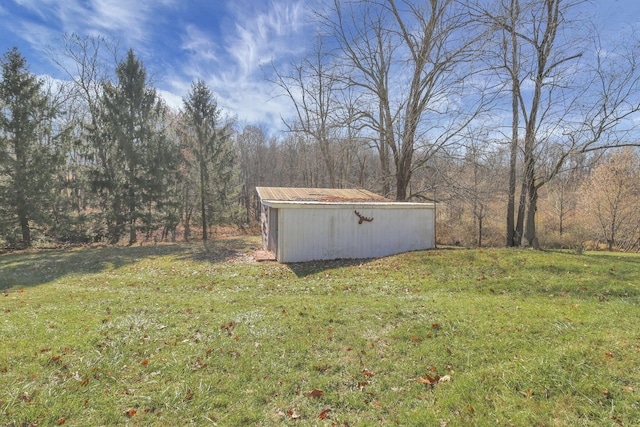 760 Henpeck Rd, Utica, OH 43080 - view of grassy yard featuring an outbuilding and a view of trees