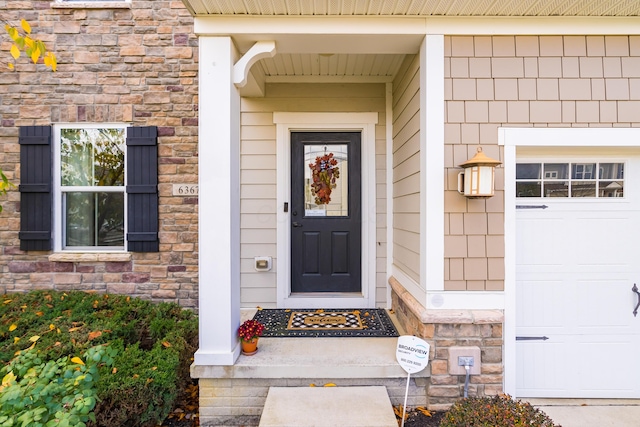 doorway to property featuring a garage