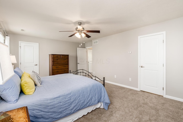 bedroom with ceiling fan and carpet floors