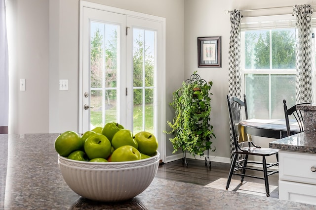 doorway with dark hardwood / wood-style flooring