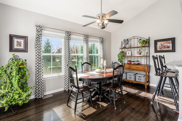 dining space featuring vaulted ceiling, ceiling fan, and dark hardwood / wood-style floors