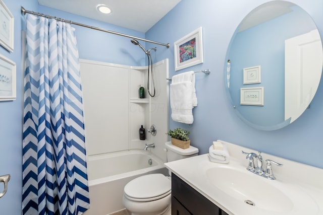 full bathroom with shower / bath combo with shower curtain, vanity, and toilet