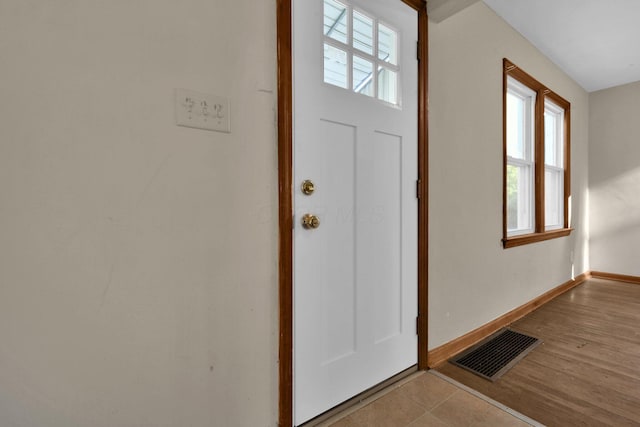 entryway with light hardwood / wood-style floors