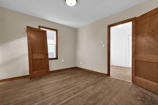 unfurnished room featuring hardwood / wood-style floors