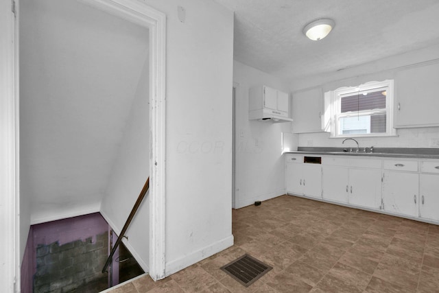 kitchen with white cabinets and sink