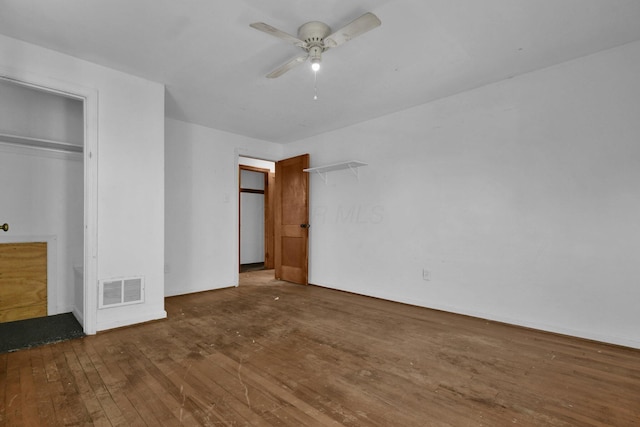 unfurnished bedroom with ceiling fan and hardwood / wood-style floors