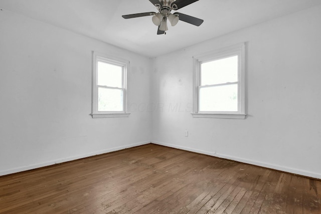 unfurnished room featuring ceiling fan and hardwood / wood-style floors