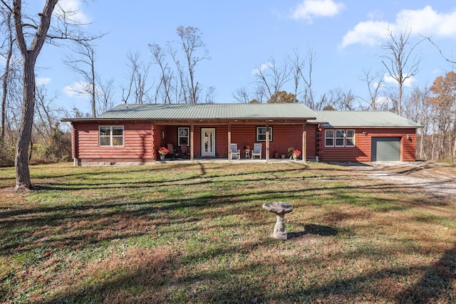 view of front of house with a front yard and a garage