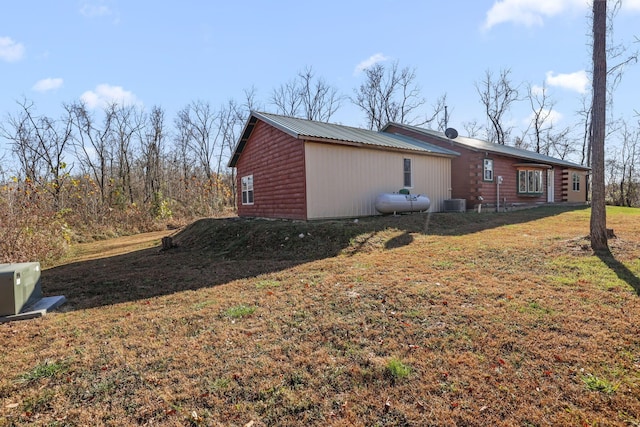 view of home's exterior featuring a lawn