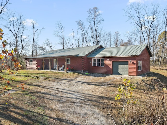 view of front of property with a porch and a garage