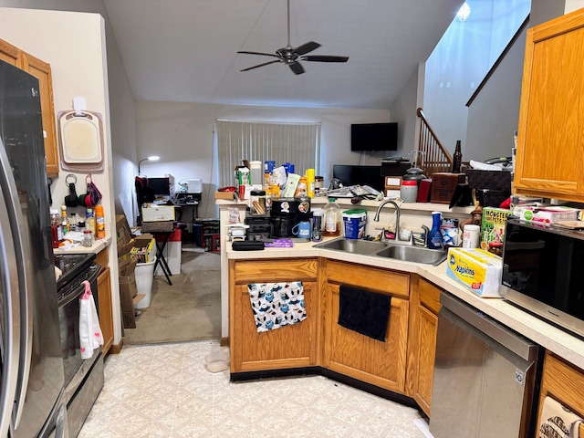 kitchen with stainless steel appliances, ceiling fan, and sink