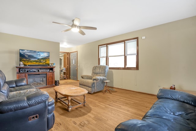 living room with hardwood / wood-style flooring and ceiling fan