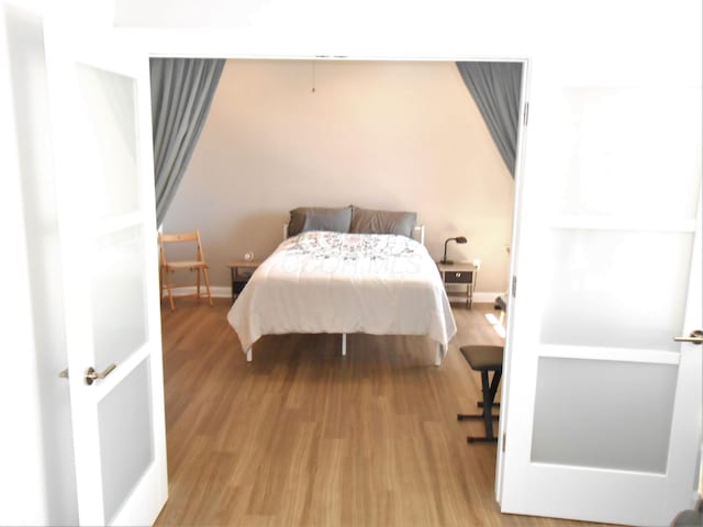 bedroom with light hardwood / wood-style flooring