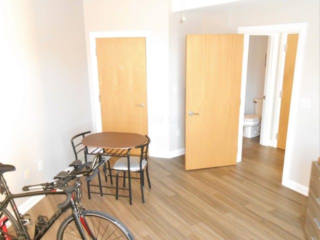 dining room with hardwood / wood-style flooring