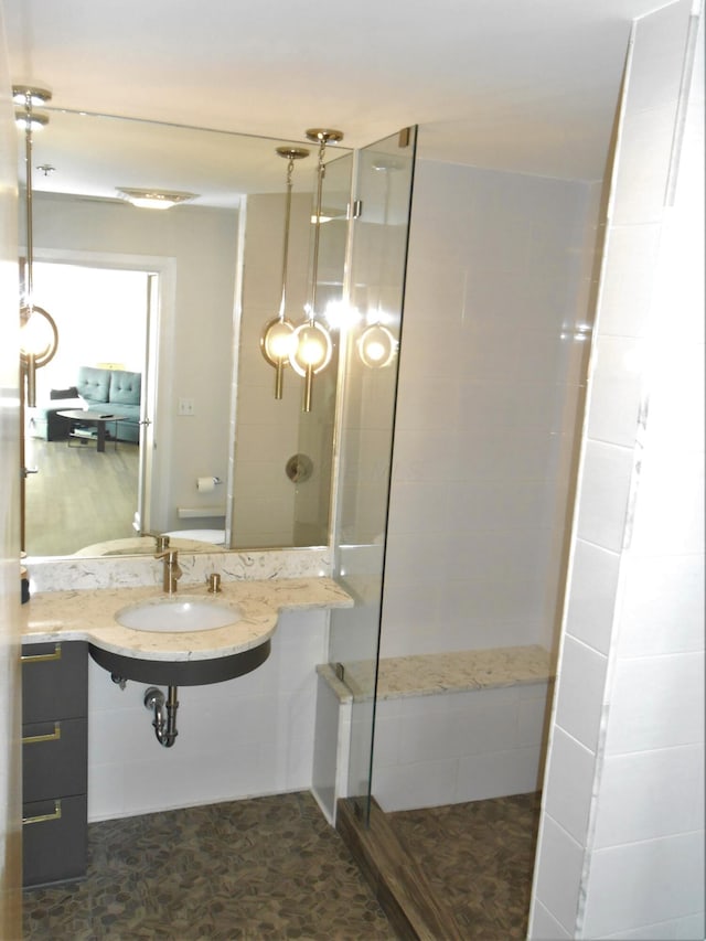 bathroom with a tile shower