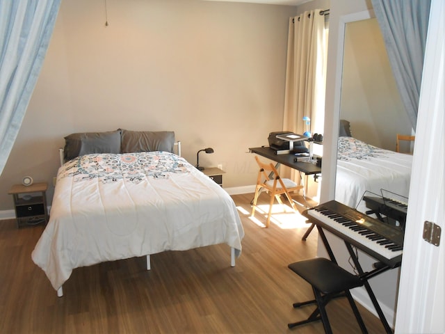 bedroom with wood-type flooring