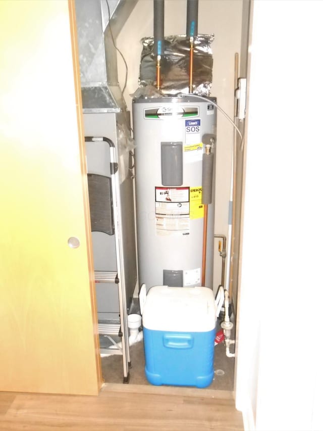 utility room featuring electric water heater