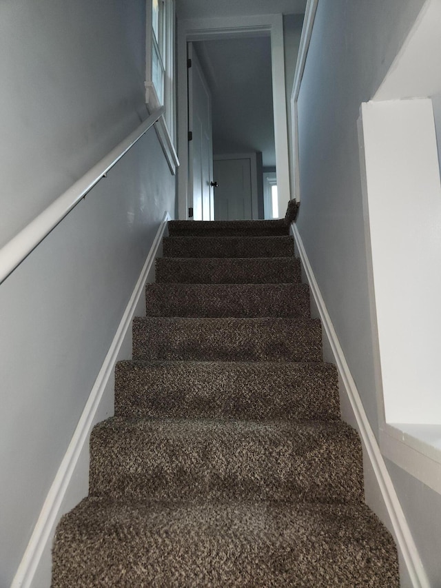 staircase with baseboards