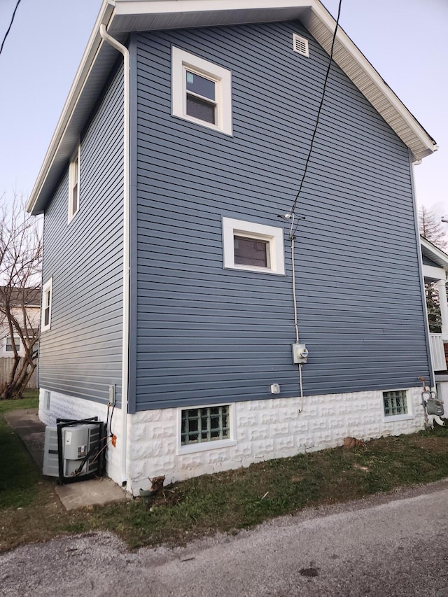 view of property exterior featuring central AC