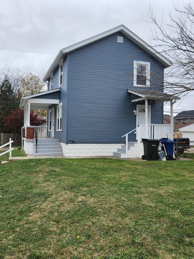 exterior space featuring a front lawn and fence