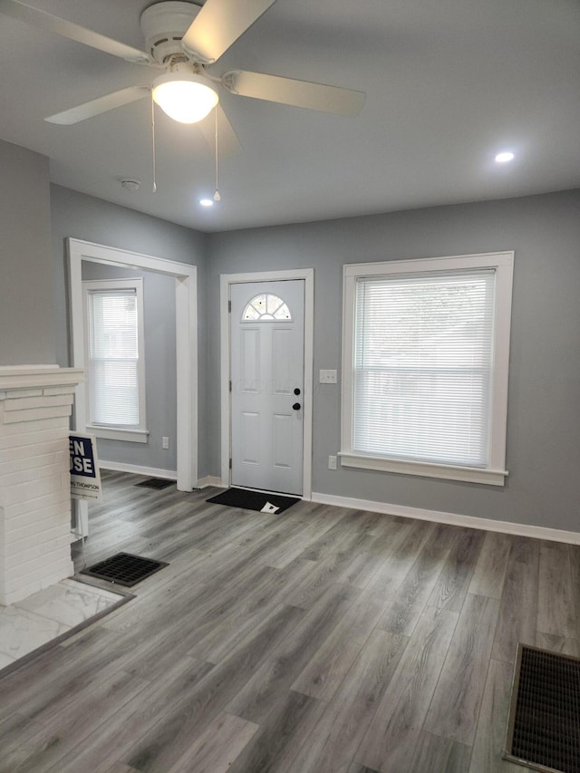 entrance foyer featuring visible vents, recessed lighting, baseboards, and wood finished floors