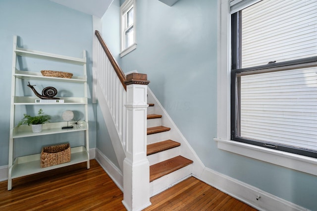 stairs with wood-type flooring