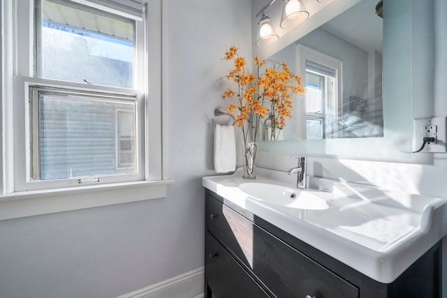 bathroom with vanity and a healthy amount of sunlight