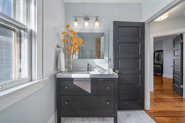 bathroom with wood-type flooring and vanity