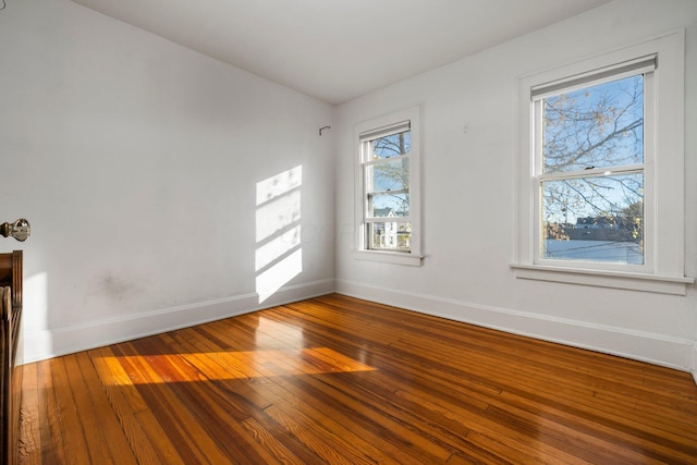 empty room featuring hardwood / wood-style flooring