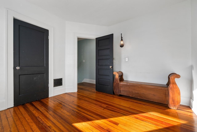 unfurnished bedroom featuring hardwood / wood-style floors