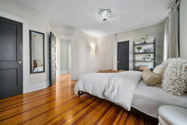 bedroom with hardwood / wood-style floors