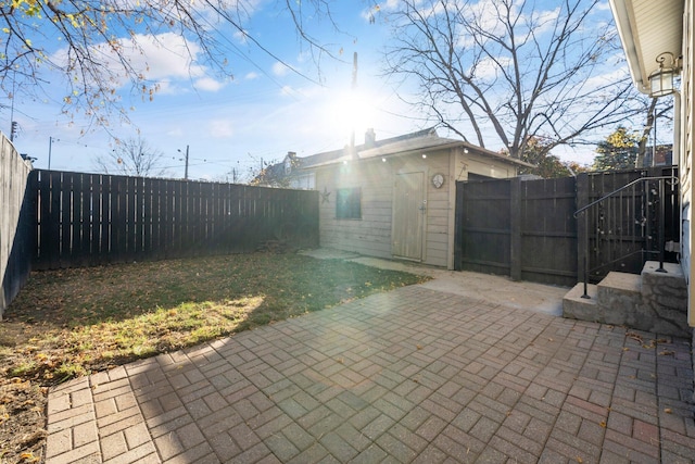 view of yard with an outdoor structure and a patio area