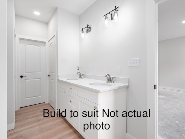 bathroom featuring vanity and hardwood / wood-style flooring