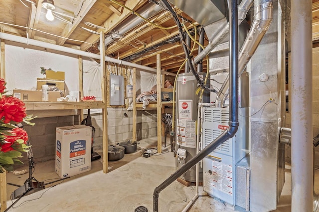 basement featuring electric panel, heating unit, and gas water heater