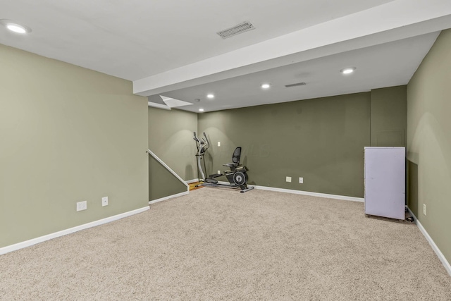 exercise room featuring carpet flooring