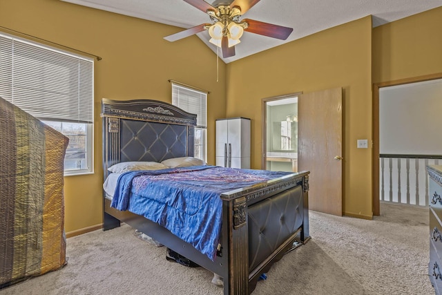 bedroom featuring carpet flooring, ceiling fan, and vaulted ceiling